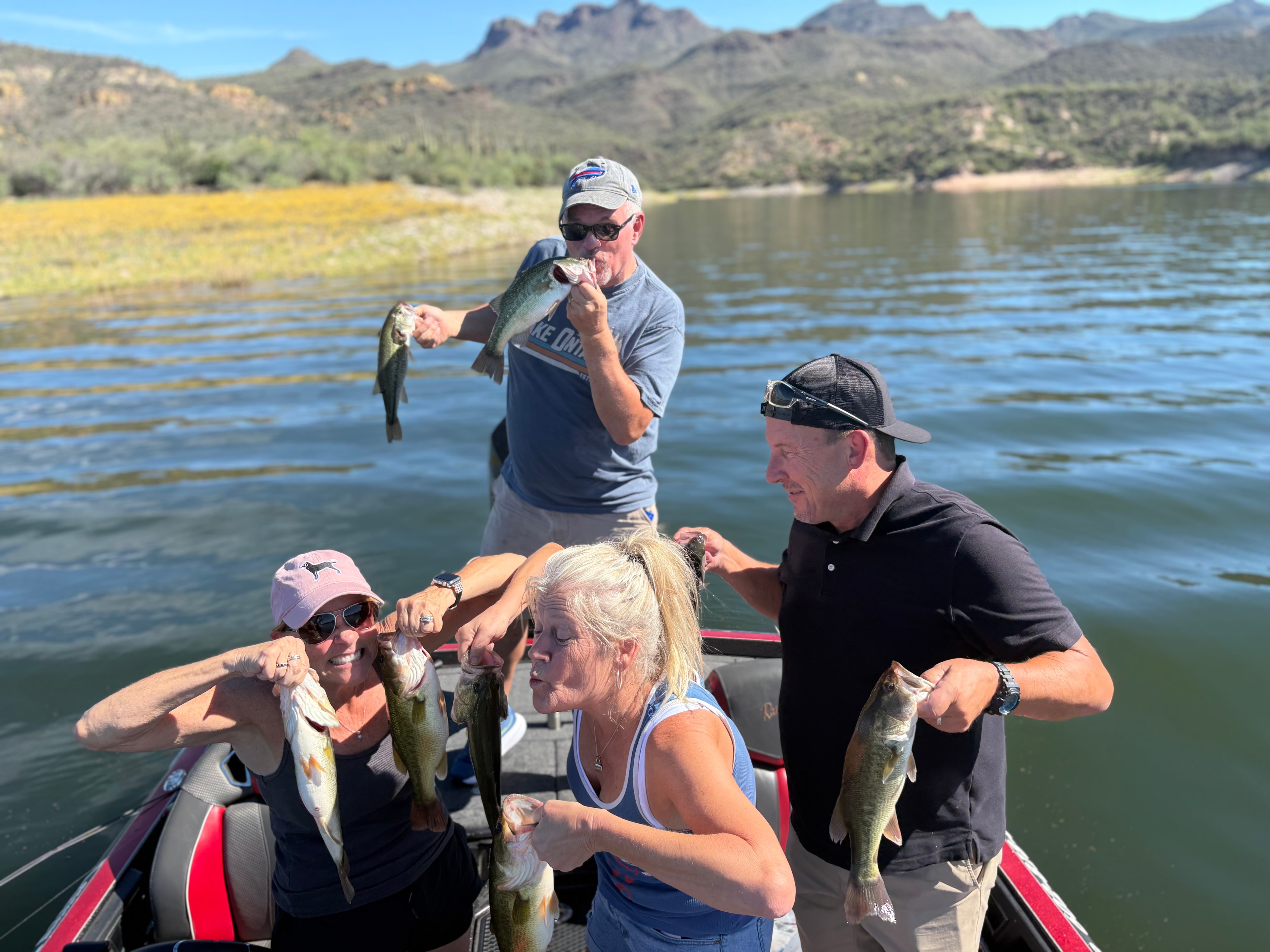 Group fishing trip mountain lake catch