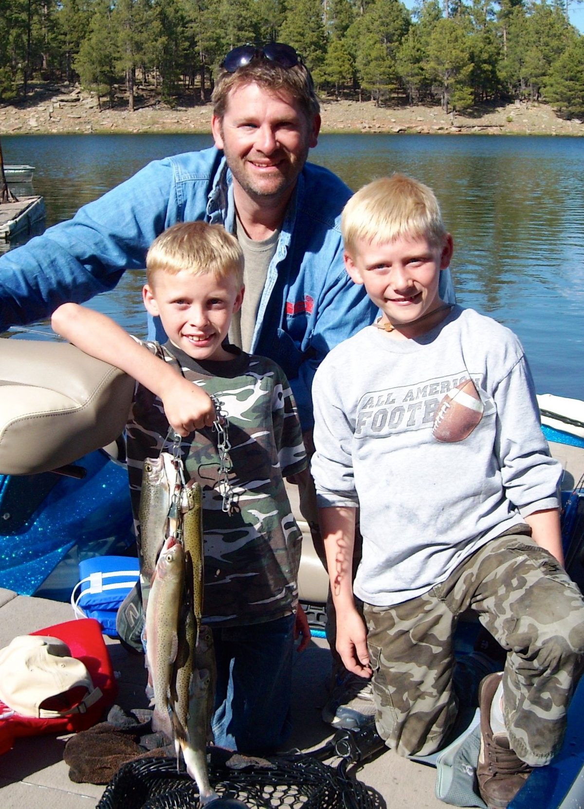 father with 2 children after catching fish in AZ lake